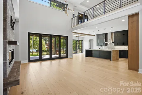 a view of a kitchen with a sink and a large window
