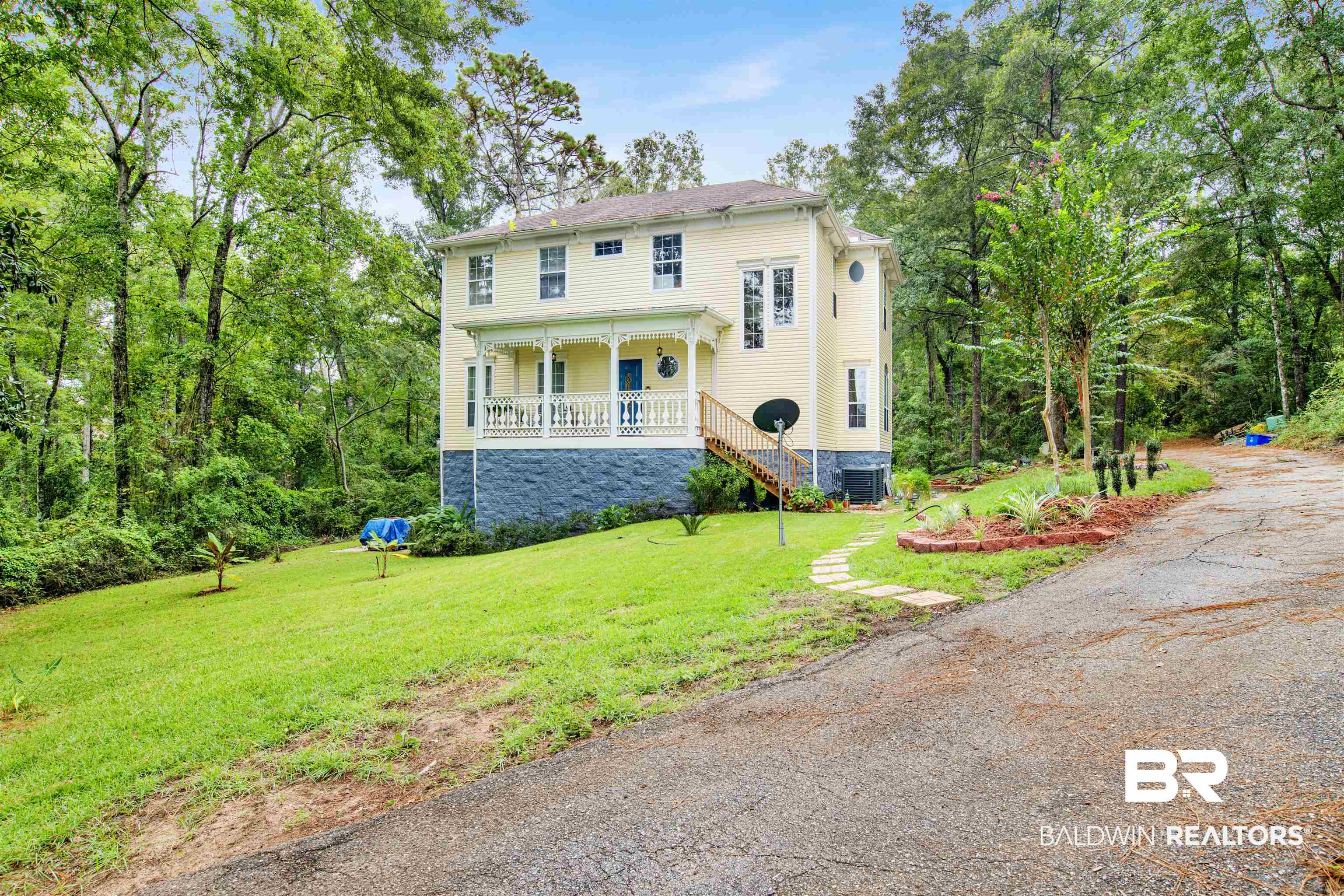 7641 Hitt Road Mobile, AL 36695 - Photo 1 of 29 View of front of house with central AC, covered porch, and a front lawn