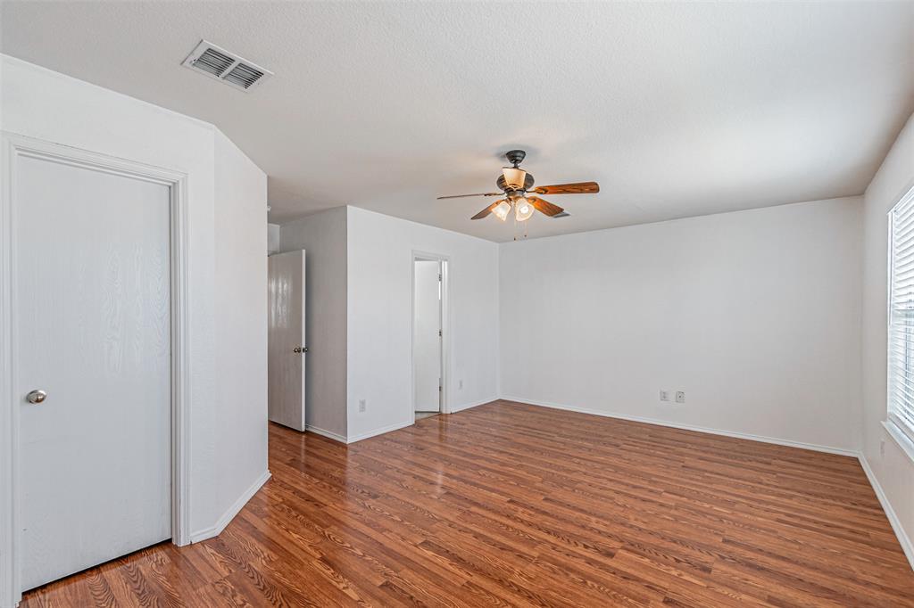 7804 Hidden Path Lane Denton, TX 76210 - Photo 18 of 40 a view of empty room with wooden floor