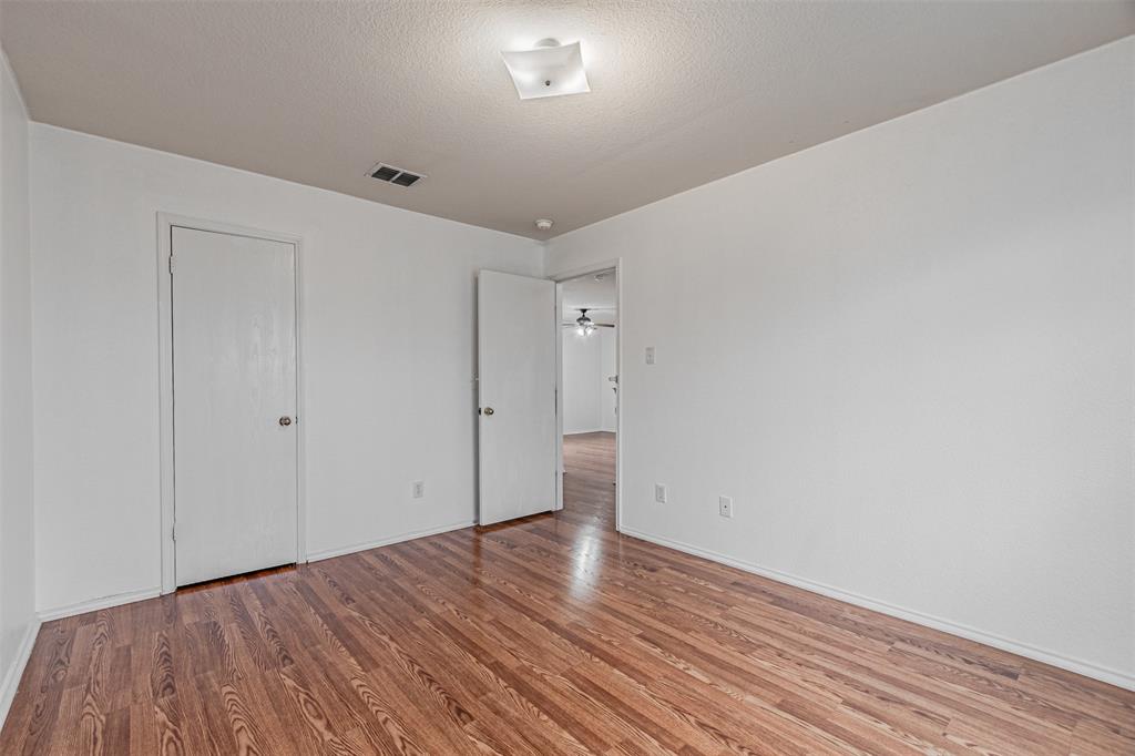 7804 Hidden Path Lane Denton, TX 76210 - Photo 33 of 40 a view of empty room with wooden floor