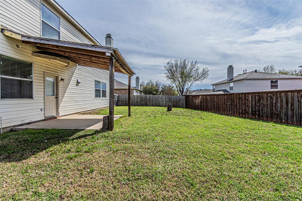 7804 Hidden Path Lane Denton, TX 76210 - Photo 37 of 40 Fenced backyard with a patio