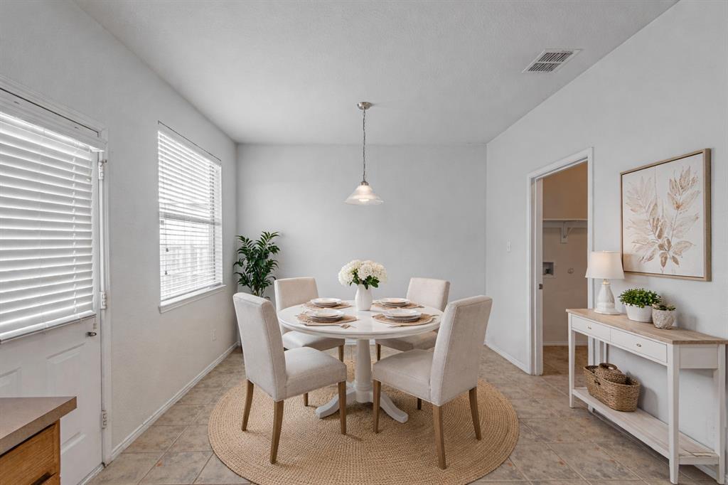 7804 Hidden Path Lane Denton, TX 76210 - Photo 8 of 40 a dining room with furniture and window