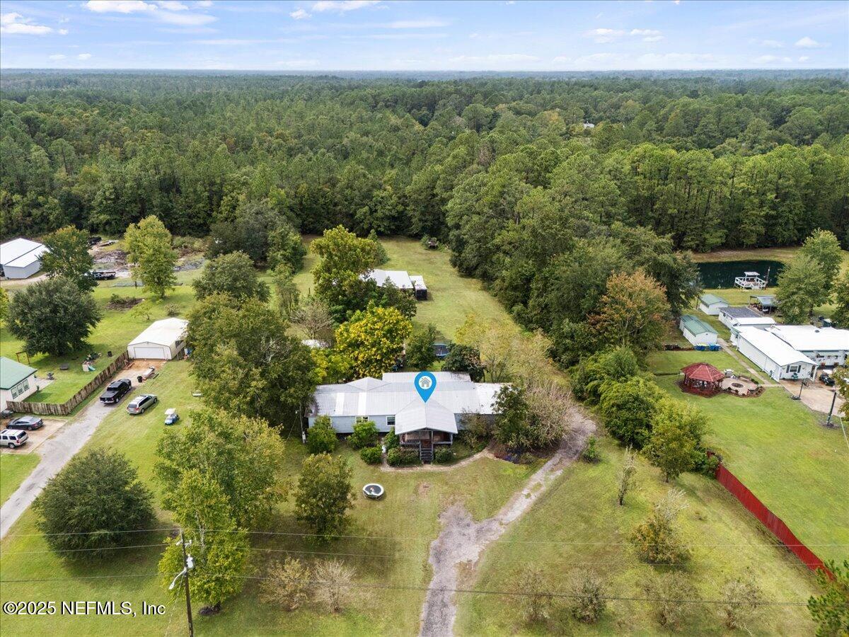 15296 Parete Road Jacksonville, FL 32218 - Photo 1 of 1 an aerial view of residential houses with outdoor space