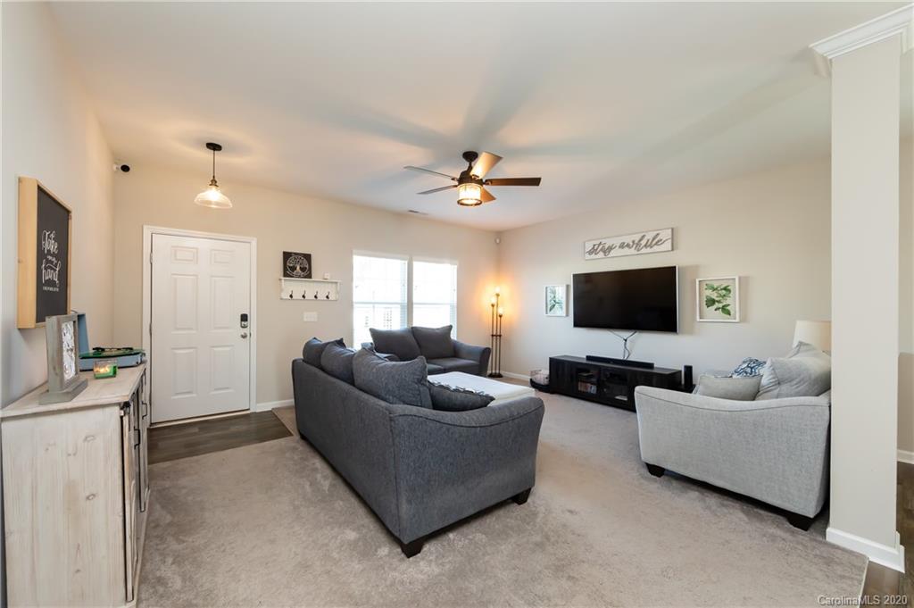 12525 Garron Road Midland, NC 28107 - Photo 3 of 41 a living room with furniture and a flat screen tv