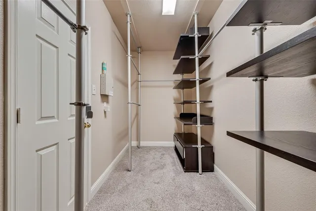 a kitchen with counter top space sink and cabinets