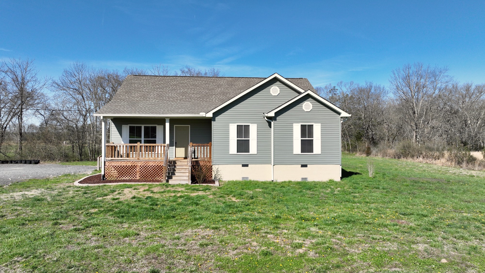 6952 Cainsville Road Lebanon, TN 37090 - Photo 1 of 48 a front view of a house with garden