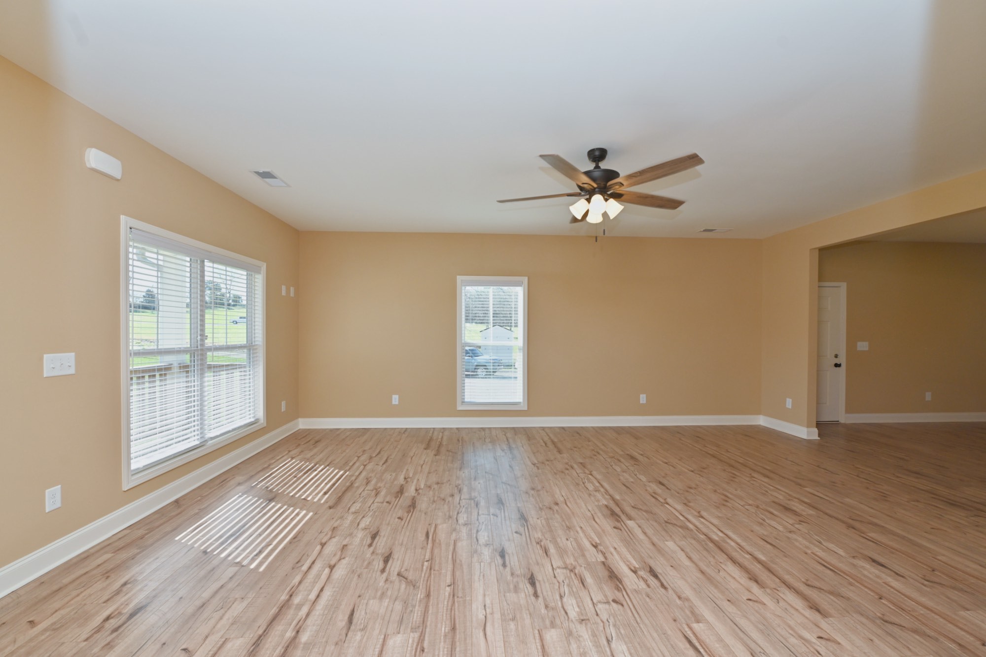 6952 Cainsville Road Lebanon, TN 37090 - Photo 3 of 48 a view of an empty room with wooden floor and a window