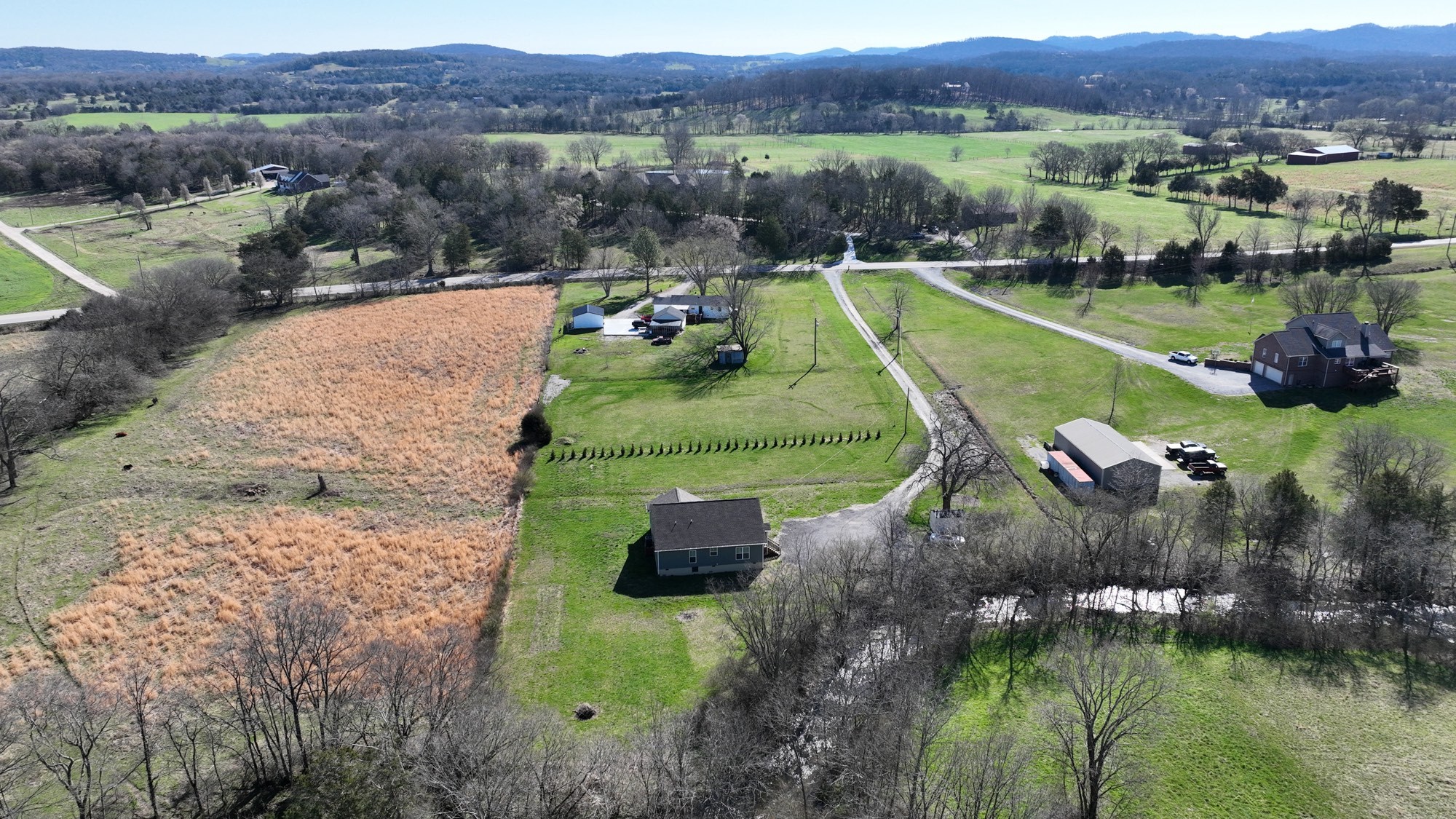6952 Cainsville Road Lebanon, TN 37090 - Photo 47 of 48 an aerial view of a house with a garden and lake view