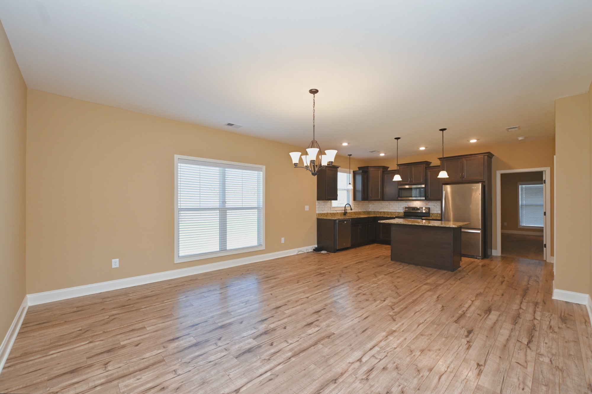 6952 Cainsville Road Lebanon, TN 37090 - Photo 6 of 48 a large kitchen with kitchen island a sink stainless steel appliances and cabinets