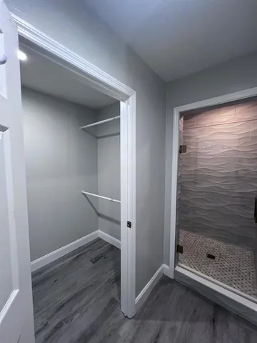 a white toilet sitting next to a small sink