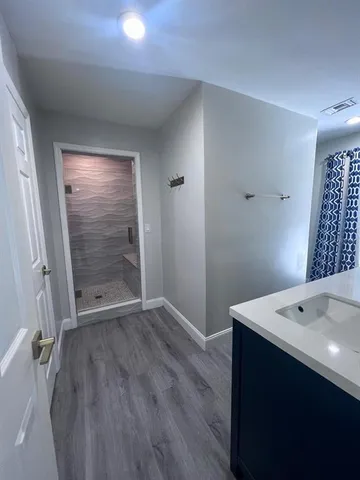 a view of empty room with a fireplace