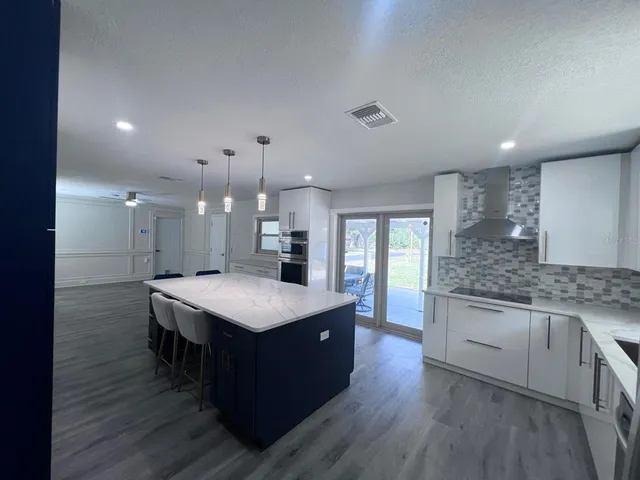 a spacious bedroom with two beds and a window