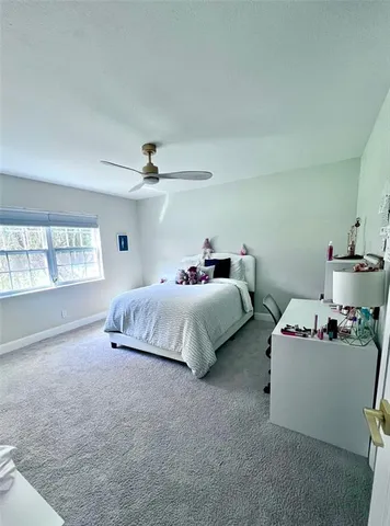 a view of an empty room with floor to ceiling window and windows