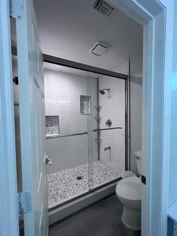 a view of hallway with wooden floor