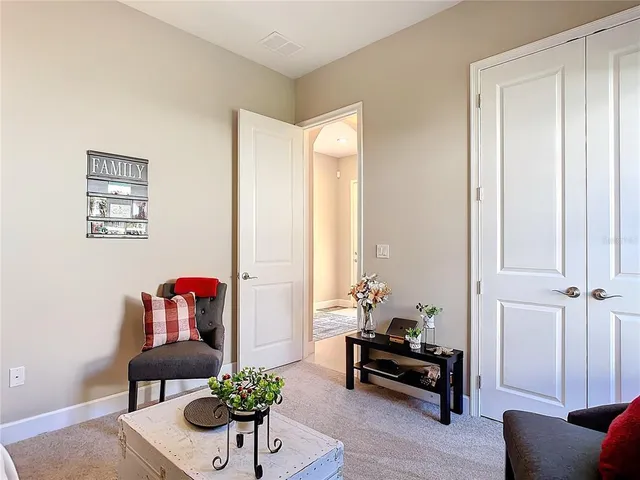 a living room with furniture and a table