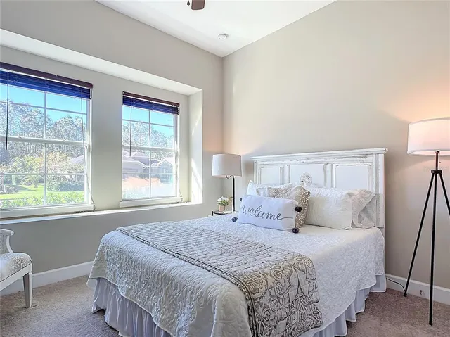 a bedroom with a bed and a table