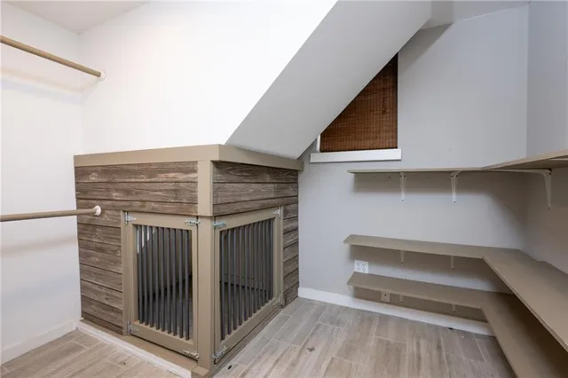 a view of a room that has a bench in it