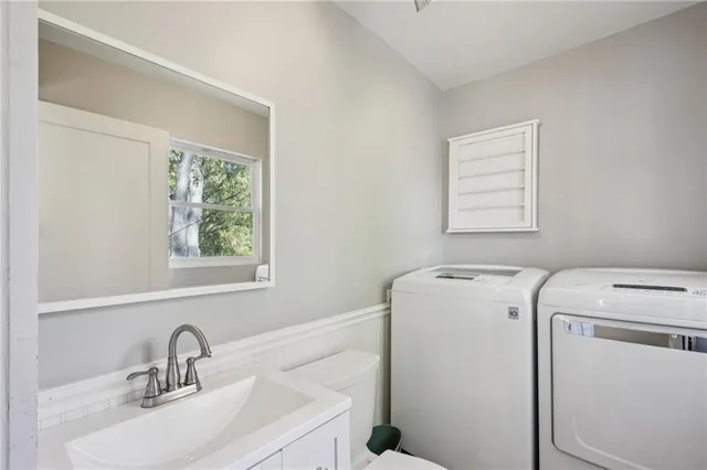 a view of storage and utility room with washer and dryer
