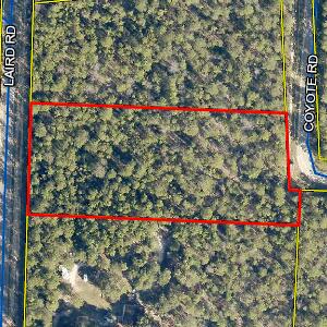 Tbd Laird Road Crestview, FL 32539 - Photo 1 of 1 a small yard with red and white house