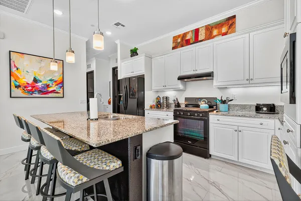a white toilet sitting next to a bathroom