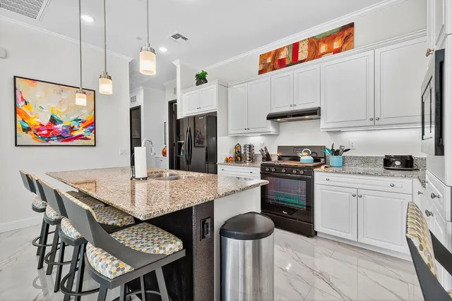 a white toilet sitting next to a bathroom