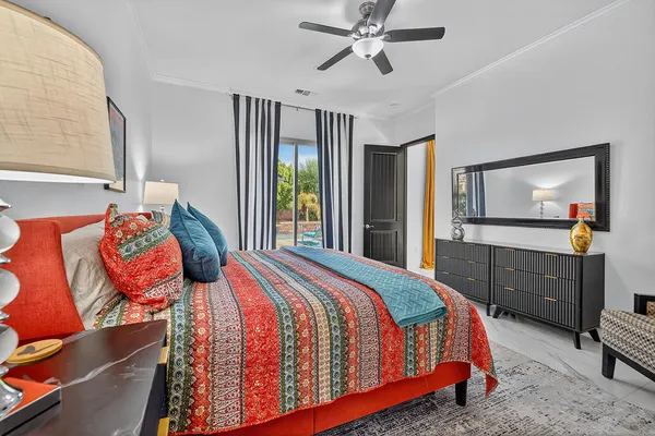 a room with wooden floor pool table and chairs