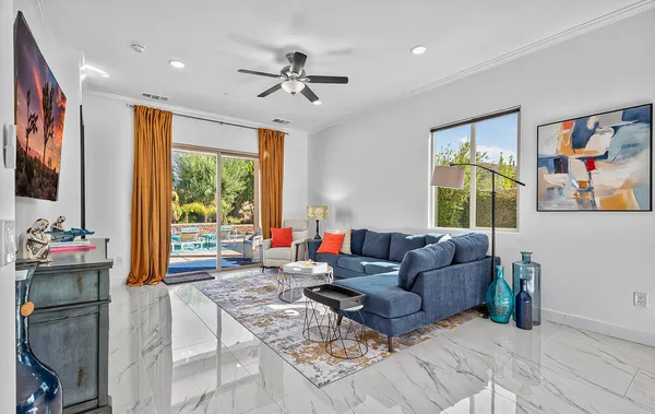 a bedroom with a bed a dresser and a window