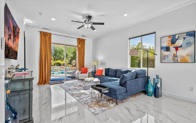 a bedroom with a bed a dresser and a window