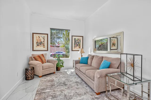 a bathroom with a double vanity sink mirror and shower