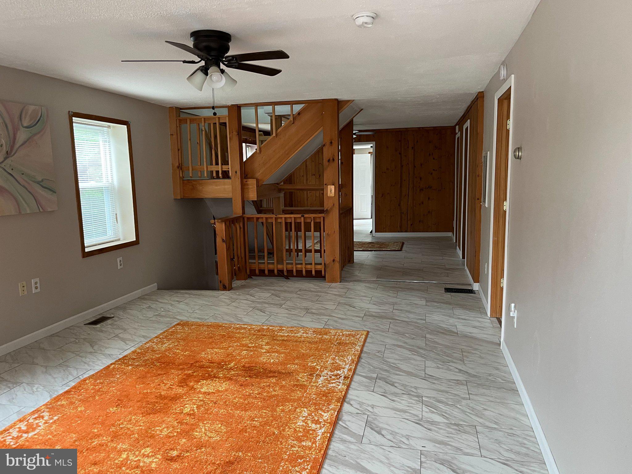 112 1st Avenue Tuckerton, NJ 08087 - Photo 18 of 42 Spacious living area with warm tones.