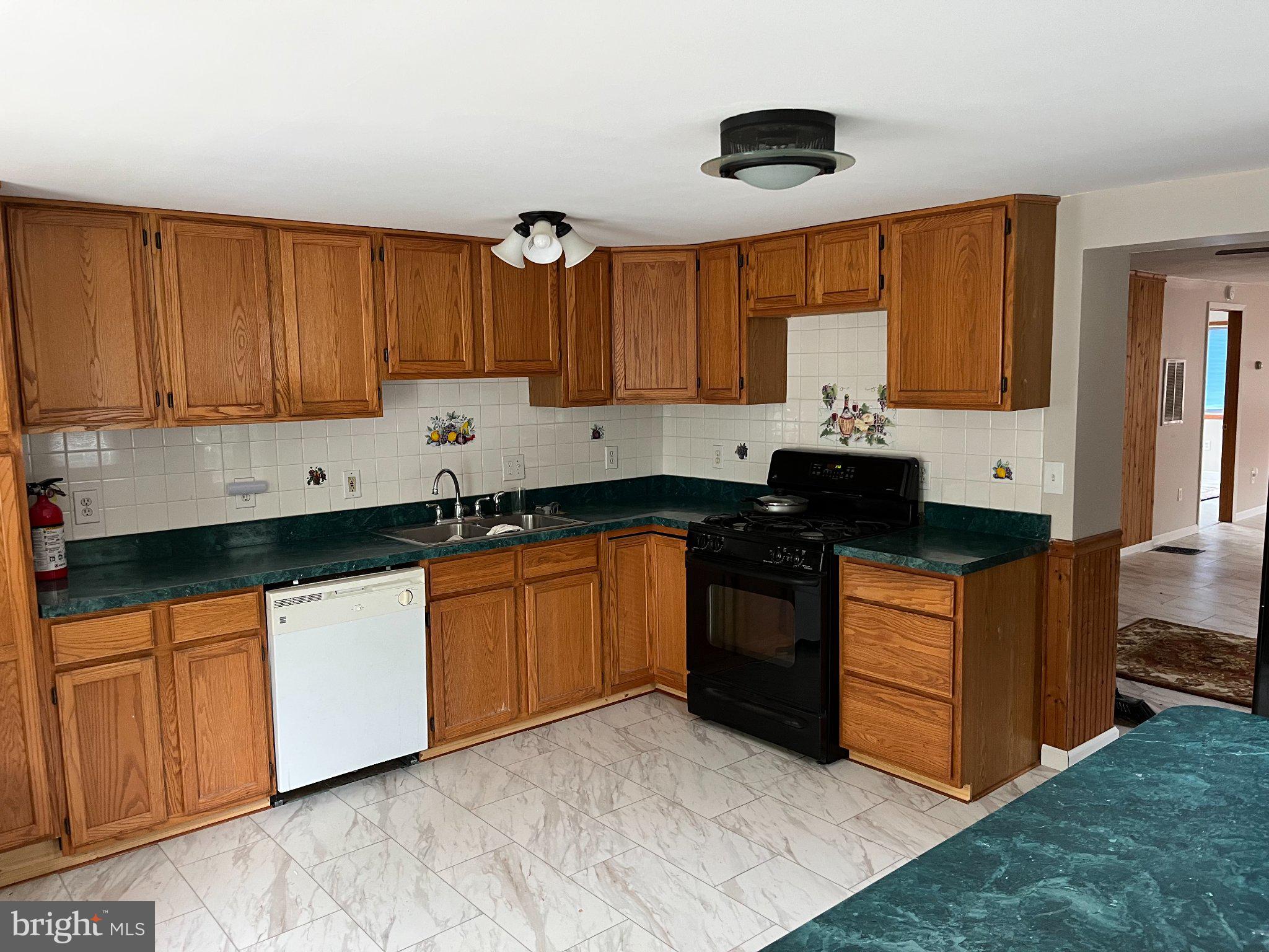 112 1st Avenue Tuckerton, NJ 08087 - Photo 21 of 42 Warm wood tones in a cozy kitchen.
