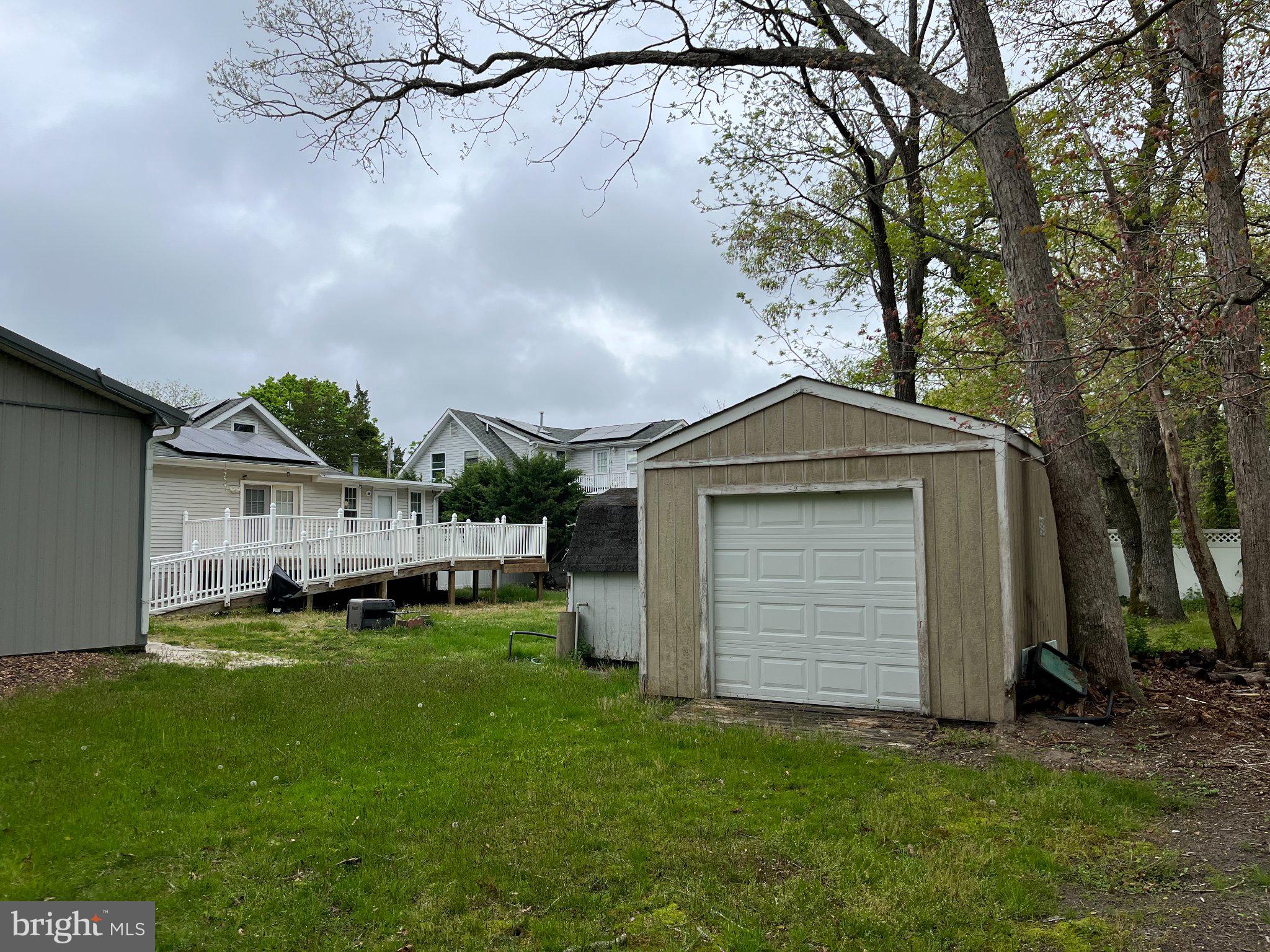 112 1st Avenue Tuckerton, NJ 08087 - Photo 8 of 42 Charming backyard with a cozy shed.