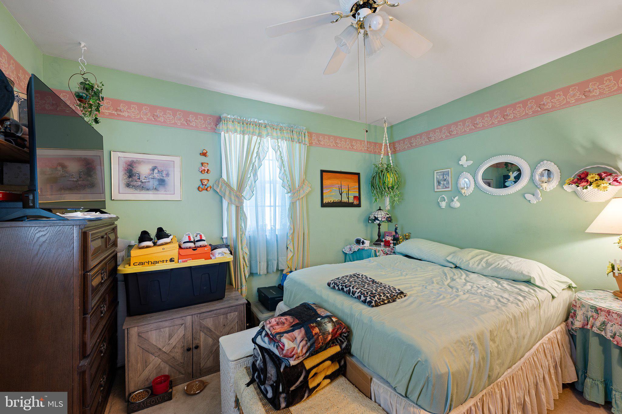 3302 Barratts Chapel Road Frederica, DE 19946 - Photo 18 of 19 a bedroom that has a bed and a table in it