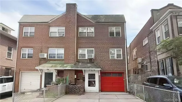 a front view of residential houses with street