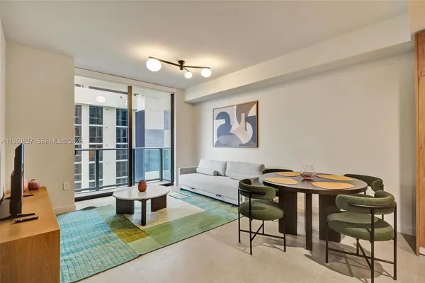 a living room with furniture and a table