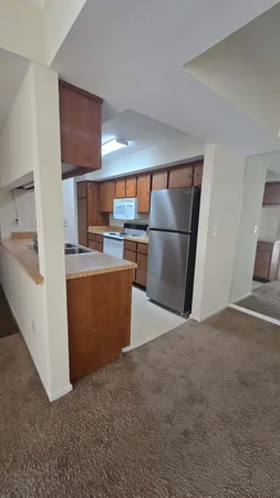 a kitchen with stainless steel appliances a refrigerator and a sink