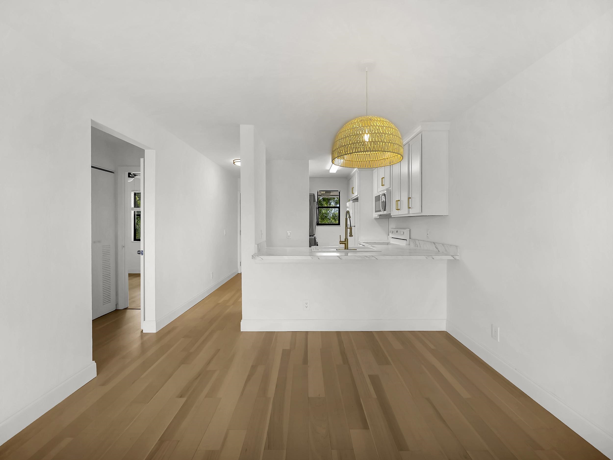 650 West Pope Road, Unit 218 St. Augustine, FL 32080 - Photo 11 of 30 a view of a kitchen from a hallway