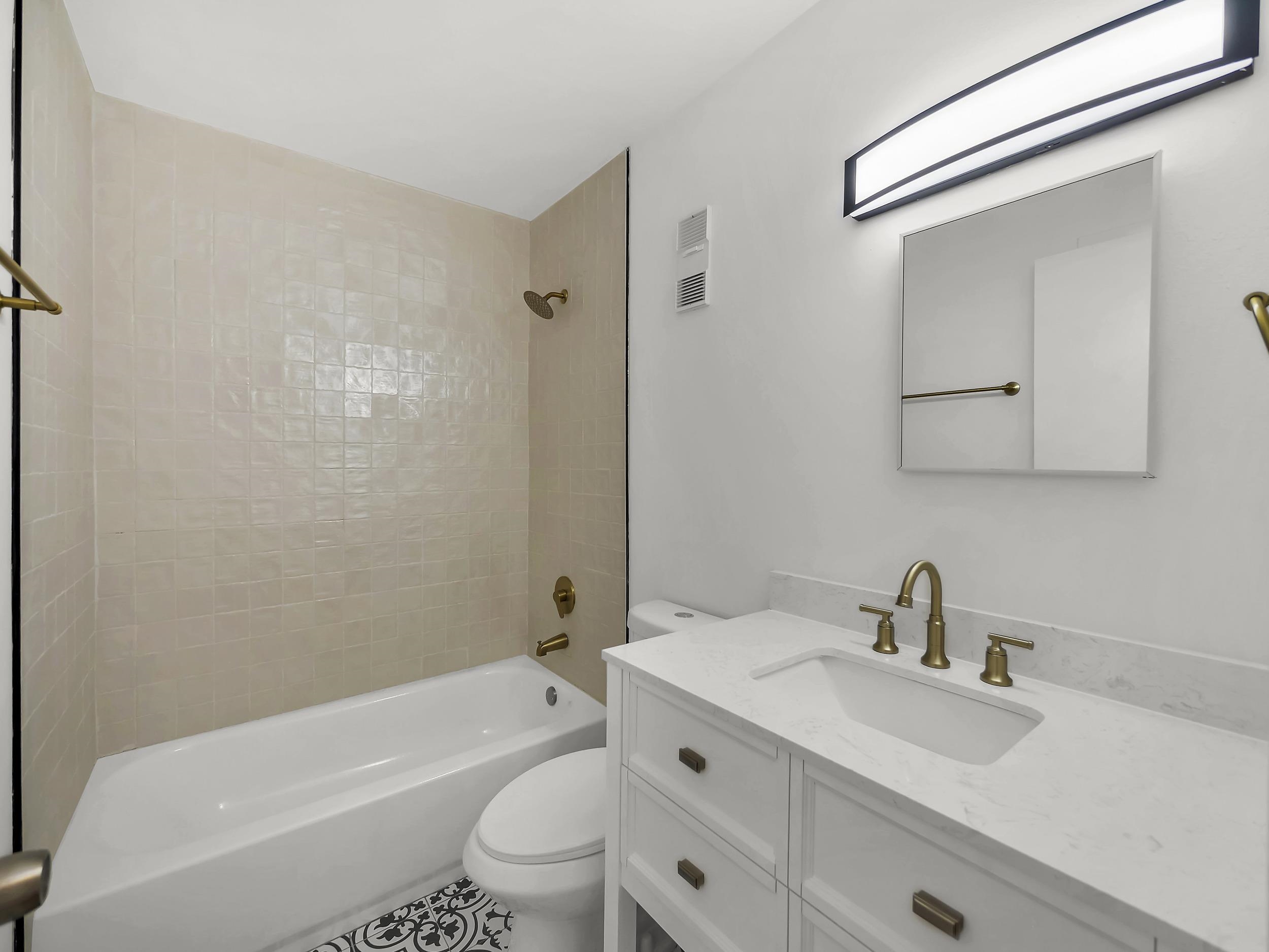 650 West Pope Road, Unit 218 St. Augustine, FL 32080 - Photo 18 of 30 a bathroom with a sink toilet a mirror and shower