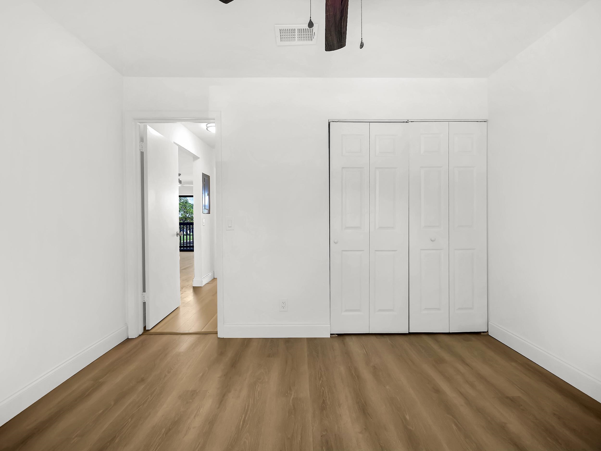 650 West Pope Road, Unit 218 St. Augustine, FL 32080 - Photo 22 of 30 a view of an empty room with wooden floor