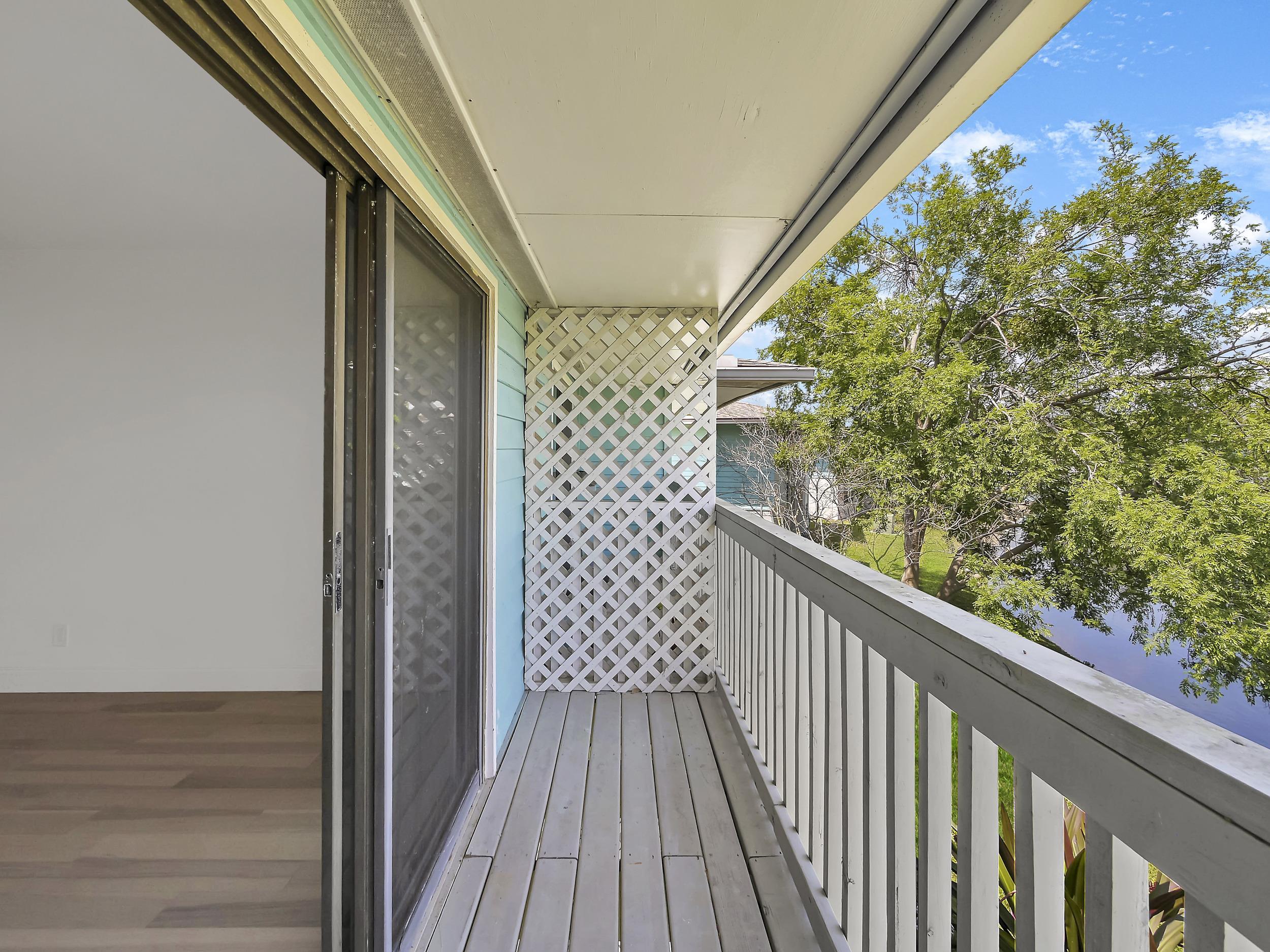 650 West Pope Road, Unit 218 St. Augustine, FL 32080 - Photo 25 of 30 a view of a balcony with wooden floor