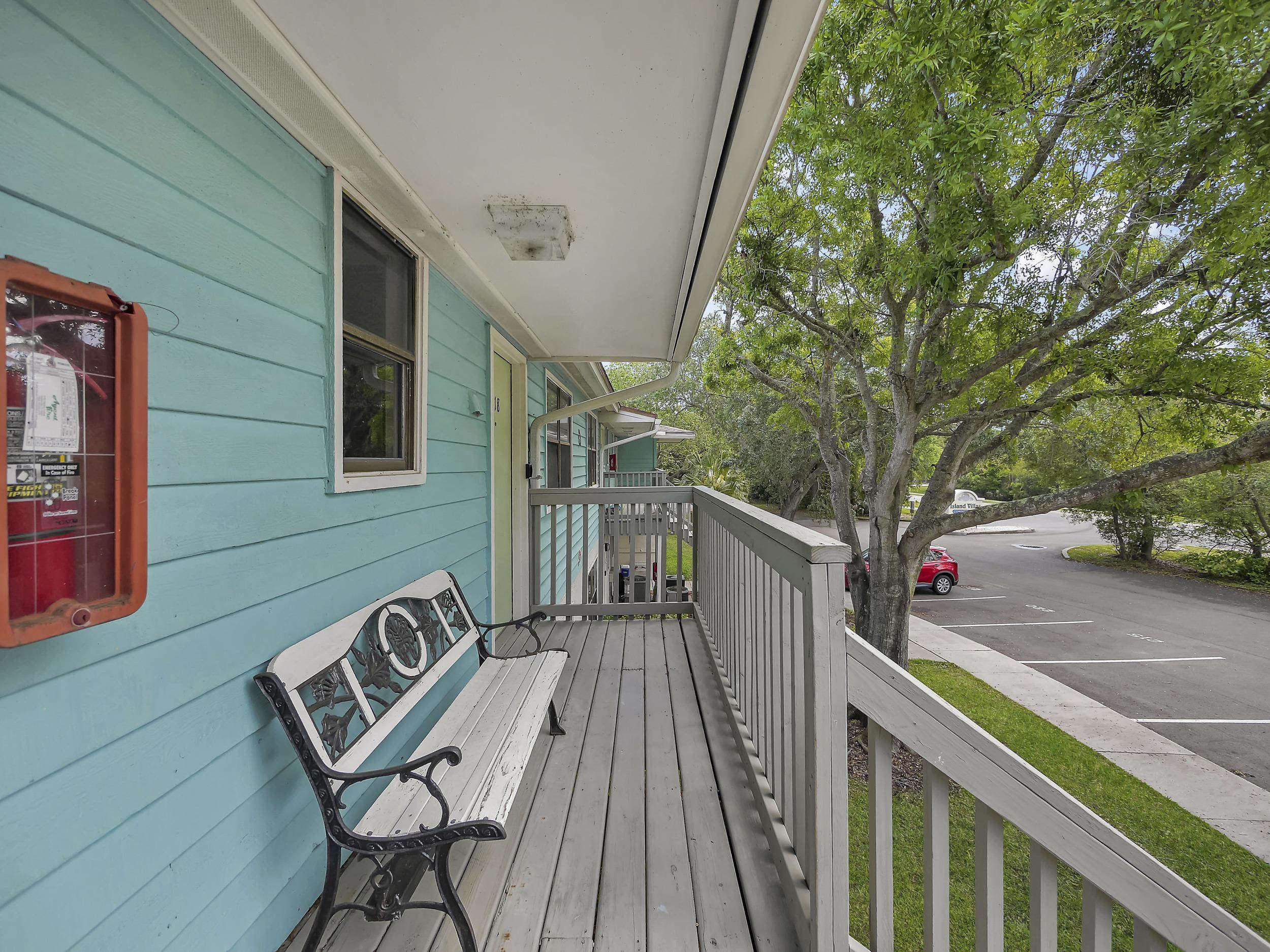 650 West Pope Road, Unit 218 St. Augustine, FL 32080 - Photo 27 of 30 a view of a wooden deck and a yard