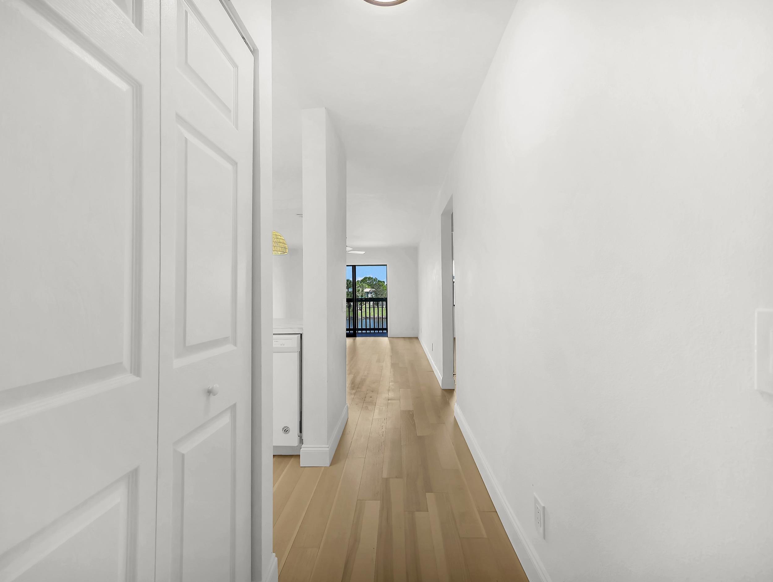 650 West Pope Road, Unit 218 St. Augustine, FL 32080 - Photo 3 of 30 a view of a hallway with wooden floor