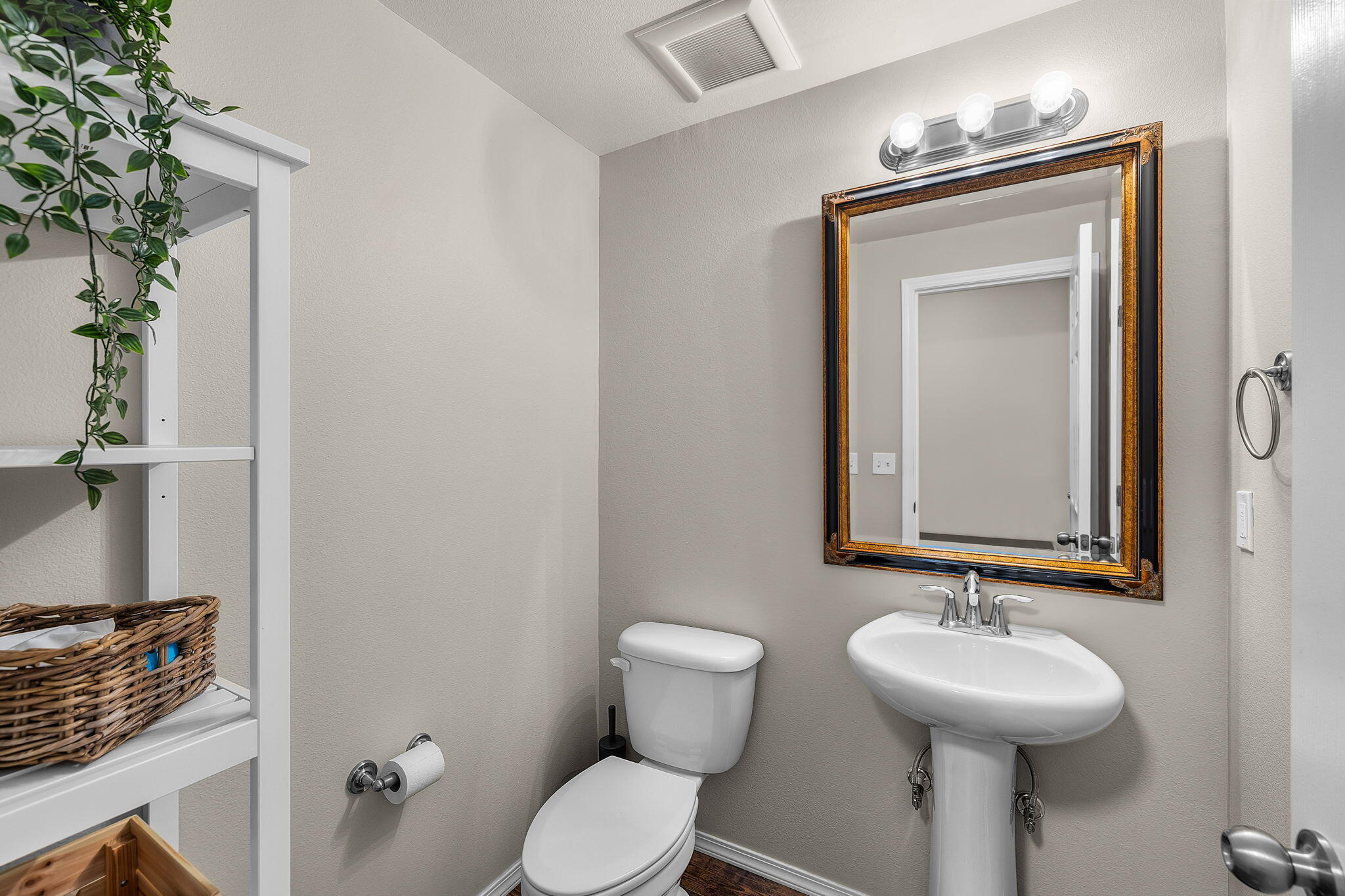 17064 Sacramento Road Bend, OR 97707 - Photo 24 of 50 a bathroom with a toilet sink and mirror