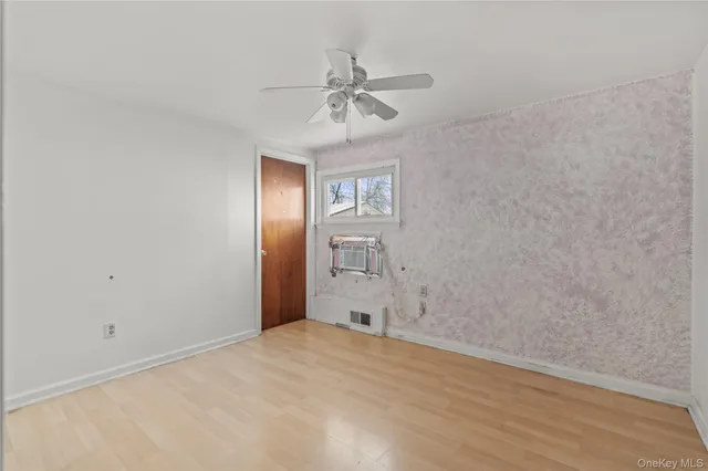 a view of a livingroom with a chandelier fan