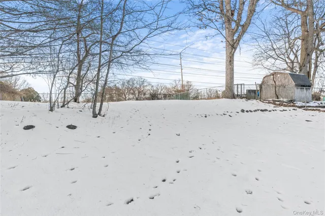 front view of a house with a wooden bench