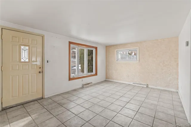 a view of an empty room and window