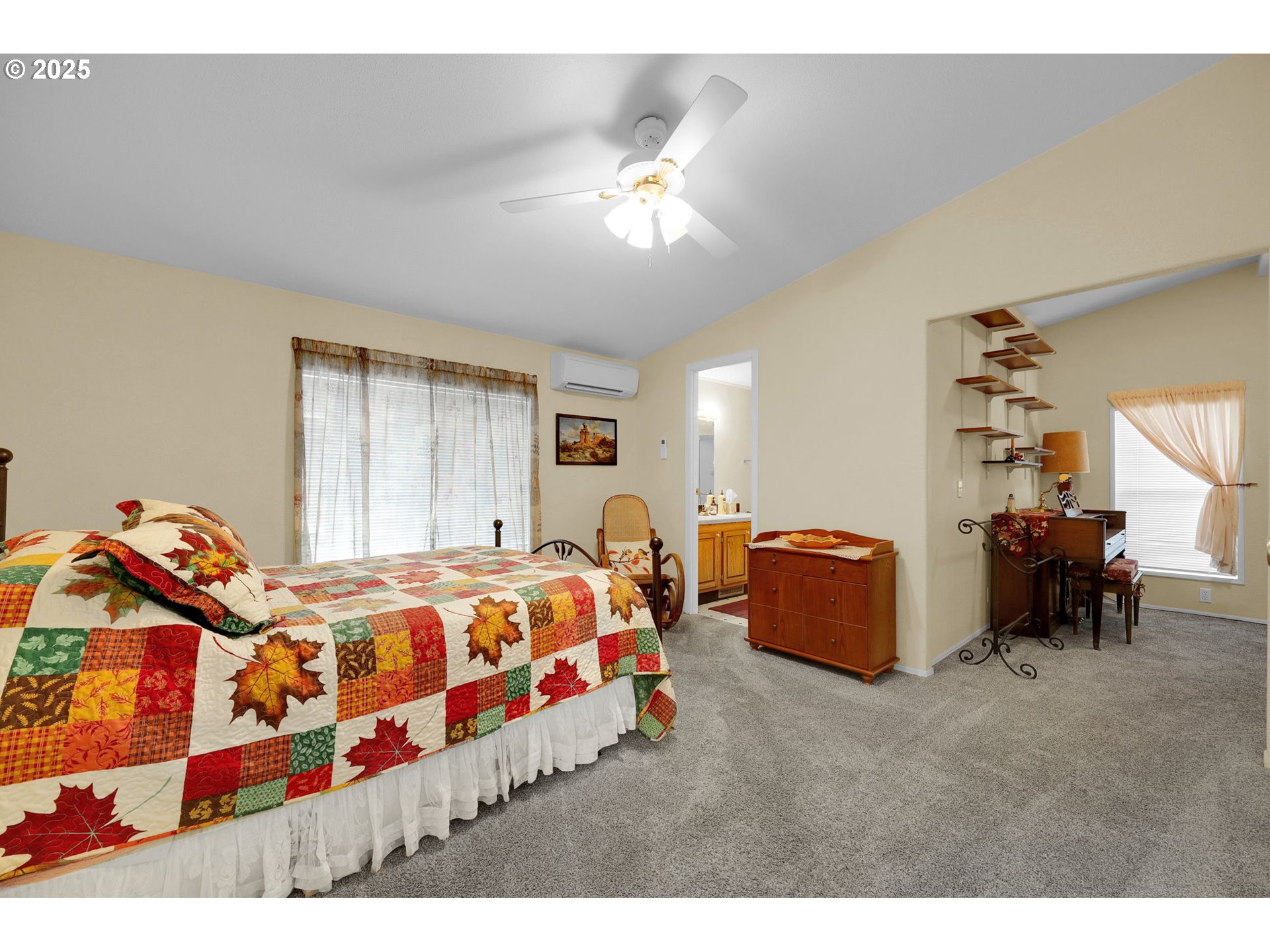 3900 Coburg Road, Unit 95 Eugene, OR 97408 - Photo 11 of 42 a bedroom with a bed and a chandelier