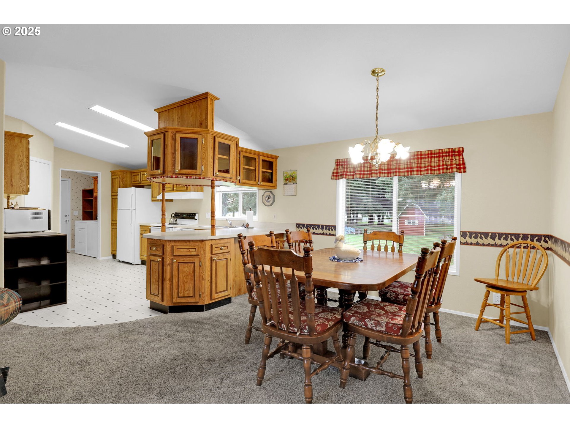 3900 Coburg Road, Unit 95 Eugene, OR 97408 - Photo 24 of 42 a view of a dining room with furniture window and wooden floor