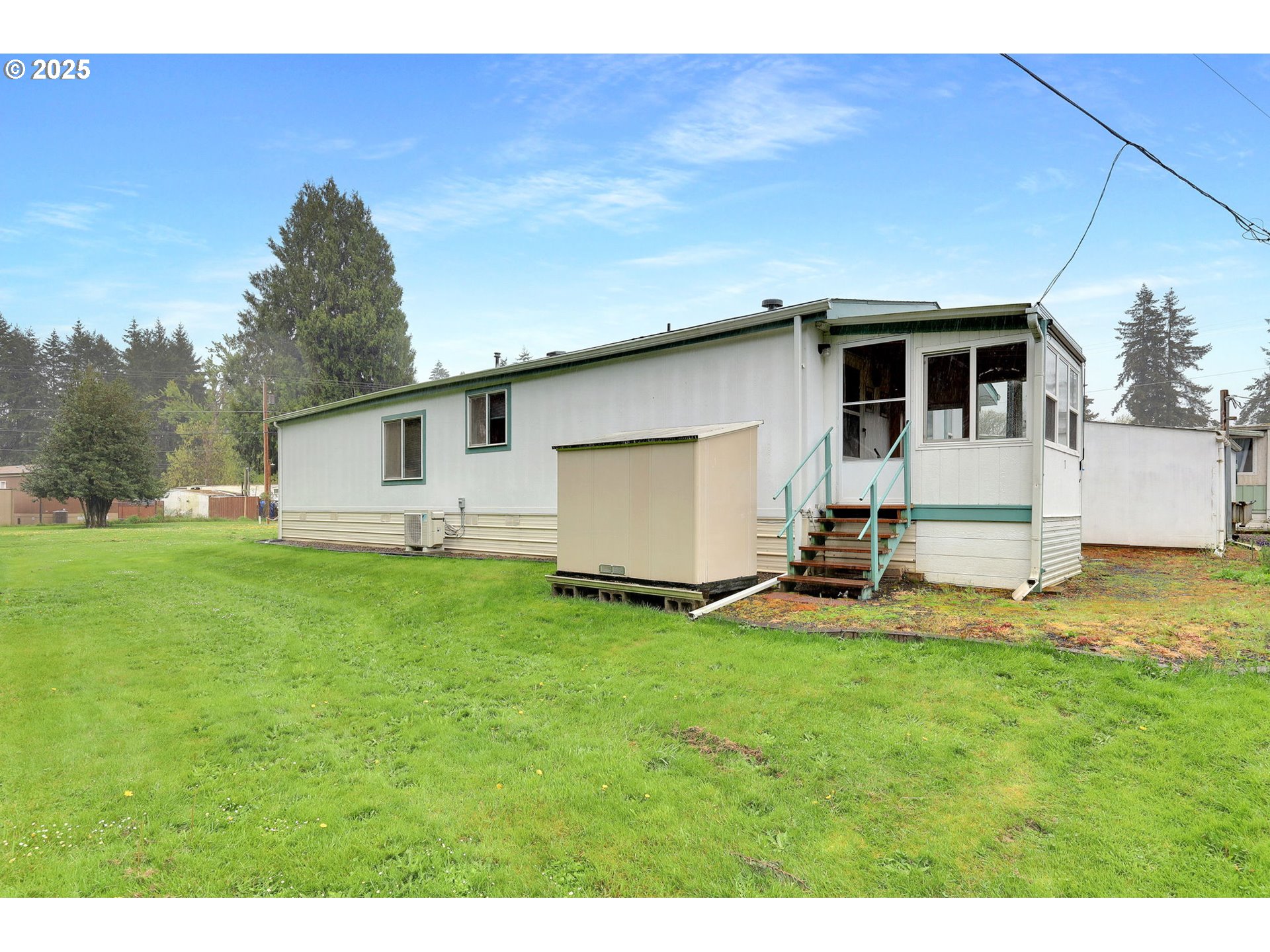 3900 Coburg Road, Unit 95 Eugene, OR 97408 - Photo 42 of 42 a front view of a house with a yard and garage