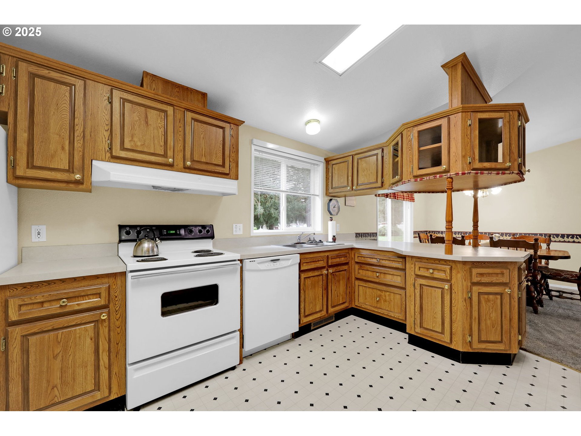3900 Coburg Road, Unit 95 Eugene, OR 97408 - Photo 8 of 42 a kitchen with stainless steel appliances granite countertop a stove a sink dishwasher and a refrigerator